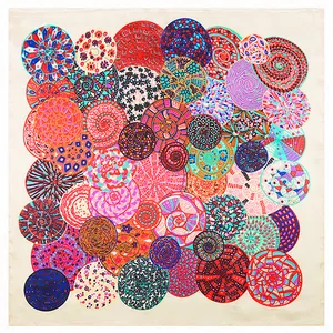 Detail of bohemian mandala patterns on silk-like scarf with vibrant colorful circles