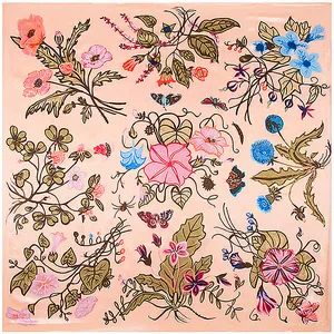 Flat lay of pink silk scarf with detailed floral patterns, butterflies and bees