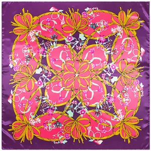 Detail of silk square scarf featuring purple floral patterns and yellow rope knots