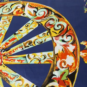 Macro detail of silk scarf showing vintage wheel pattern and baroque floral prints