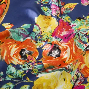 Macro shot of 90cm large square silk scarf with vivid floral print on navy blue background