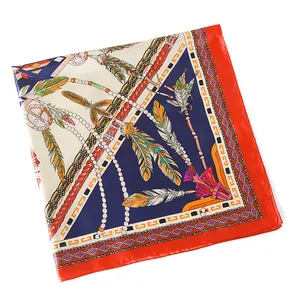 Close-up of ethnic silk scarf featuring feather patterns, bead chains and tassels