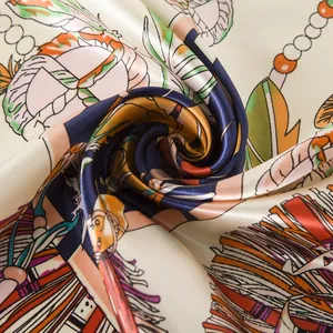 Macro detail of silky scarf with colorful ethnic feather print and smooth texture