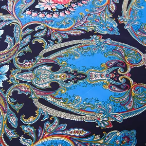 Close-up of paisley floral pattern on navy blue silk scarf with detailed ethnic embroidery