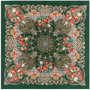 Detailed pattern of bohemian mandala and paisley motifs on dark green silk scarf