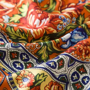 Macro detail of bohemian geometric floral patterns on premium silk-touch fabric scarf