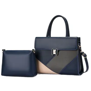 Women's 2-piece handbag set in navy blue patchwork PU leather with gold turn-lock hardware
