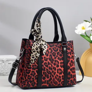 Elegant red leopard print tote bag with silk scarf handle and detachable shoulder strap