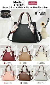 Detailed view of the multi-compartment interior structure of this faux leather handbag