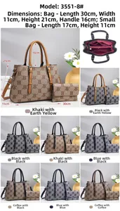 Detail of monogram tote bag set with interior pouch and textured B-pattern finish
