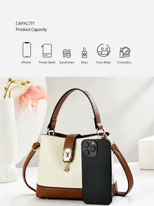 Mini bucket bag size comparison with smartphone showing daily capacity and bicolor design