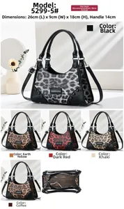 Detail view of leopard print shoulder bag with dimensions 26x9x18cm and internal zip pocket