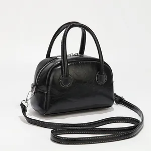 Retro black leather square bag with contrast stitching and silver-tone hardware