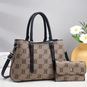 Detail of printed tote bag and matching long wallet with silver hardware