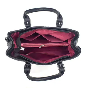 Detail of spacious tote interior with burgundy lining and multiple zip compartments