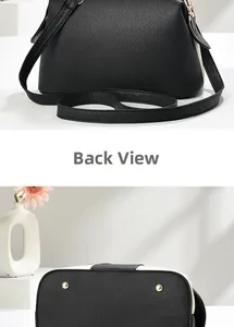 Détails de l'arrière du sac en cuir noir et des clous de protection dorés à la base