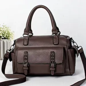 Brown leather Boston shoulder bag with vintage rivets and wide strap for women