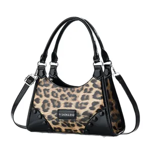 Stylish leopard print crossbody bag with black patent leather trim and long strap