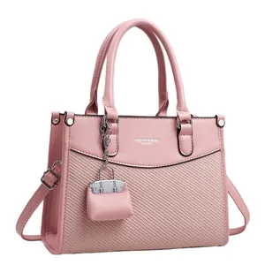 Pink woven texture tote bag with dual handles and adjustable shoulder strap for women