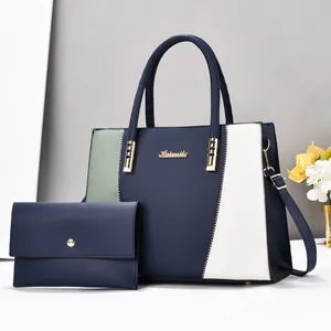 Ensemble de sac cabas bicolore et portefeuille assorti avec coutures ondulées et métal doré
