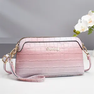 Pink gradient crocodile embossed shell handbag with gold Danbaoly logo and strap