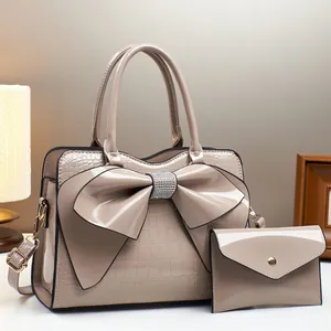 Beige crocodile embossed bucket bag with large rhinestone bow and mini wallet set