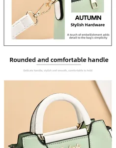 Close-up of comfortable rounded handles and golden metal hardware on mint green handbag