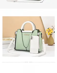 Detailed size comparison of green and white tote bag next to a mobile phone