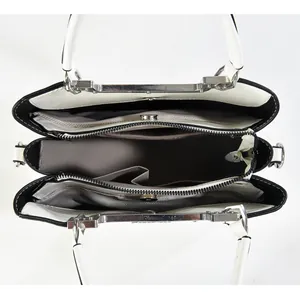 Top view showing the spacious interior with three compartments and grey lining for the bag