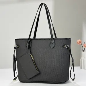 Black large capacity tote bag with cross pattern texture and gold hardware detailing