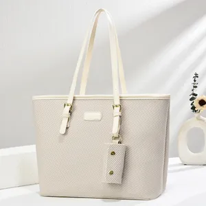 Minimalist beige woven PU tote bag with long handles and a matching mini coin purse