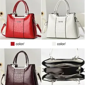 Elegant crocodile embossed faux leather handbag with metal logo and multi-compartment