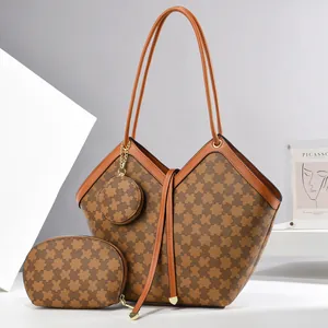 Three-piece checkered tote bag set with matching pouch and round purse in art studio setting