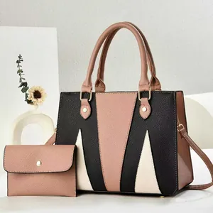 Three-tone geometric patchwork tote bag set with matching envelope pouch and gold hardware
