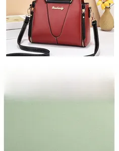 Detail showing the fine pebble grain leather texture and metallic gold zipper of the bag