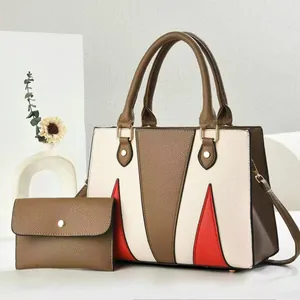 Two-piece tote bag set with color-blocking geometric design and matching envelope pouch