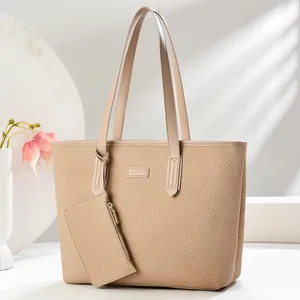Minimalist beige woven tote bag set with matching pouch on an elegant white background