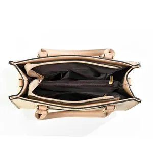 Macro view of multi-compartment interior with zipper pocket in beige contrast tote bag
