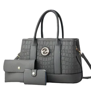 Three-piece dark grey handbag set featuring crocodile pattern embossing and gold hardware