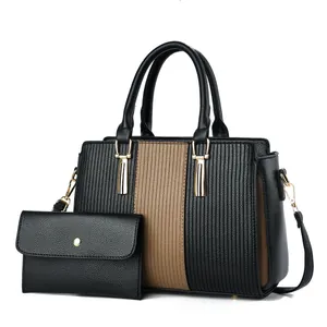 Retro black and brown tote bag set with textured surface and gold metal hardware