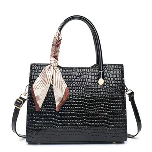 Black crocodile embossed tote bag for women with decorative scarf and gold hardware