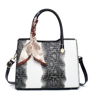 Women's crocodile pattern tote bag with color-block design and decorative silk scarf