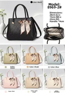 Detail view of woven texture tote bag dimensions and multi-compartment interior structure
