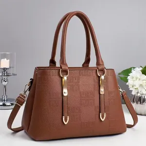 Brown lychee texture handbag with square embossing and golden metal hardware
