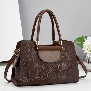Brown snake print embossed handbag for women with gold hardware and top handles
