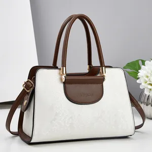 Fashionable snake-embossed contrast handbag with dual handles and adjustable strap