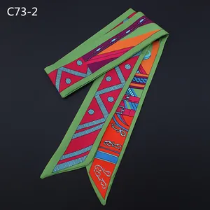 Detail of colorful twilly silk scarf with geometric patterns and retro buckle motifs