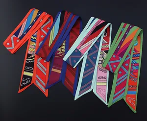 Detailed close-up of four geometric twilly silk scarves featuring equestrian belt patterns