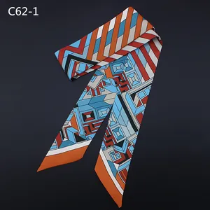 Detailed view of long skinny scarf with colorful geometric stripes and abstract patterns