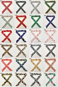 Grid layout showing 24 unique floral and geometric patterned silk twilly scarf designs